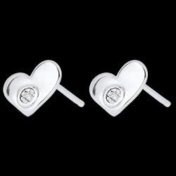 <a href=http://argent.edenly.com/boucles-d-oreilles-puces-argent/boucles-oreilles-pendantes-mon-petit-coeur-argent,6242,2022.html?liste_cat=2020X2022X2024X2023 style=color:#fff;text-decoration:none;><u>Boucles d'oreilles pendantes Mon petit coeur argent et diamant</u><br><br><b>59 €</b></a>